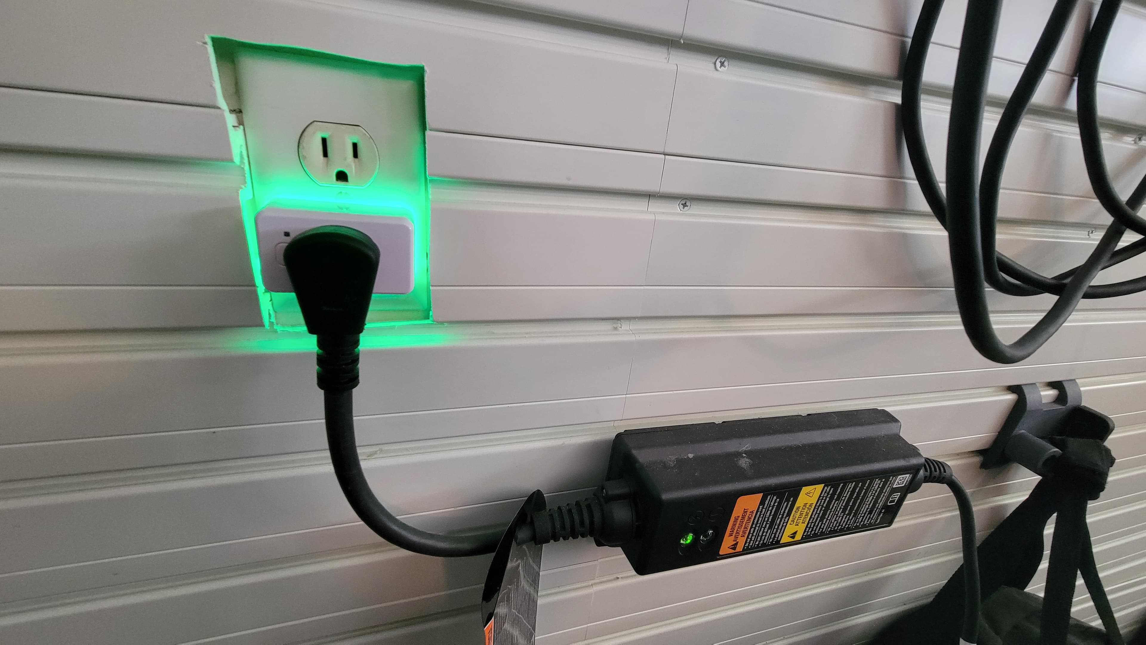Shelly Plug connected to a standard 120V outlet with an EV charge cable
